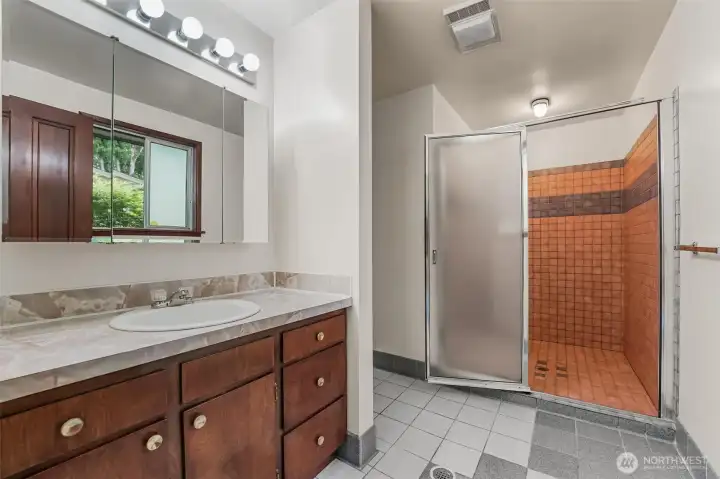 This 3/4 bath is located off the hot tub room. It could be a perfect bath for a new primary bedroom conversion!