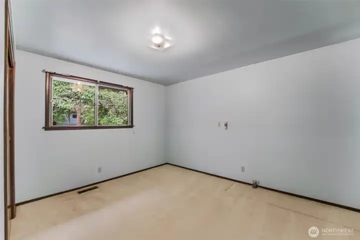 Bedroom 1 with front yard view.