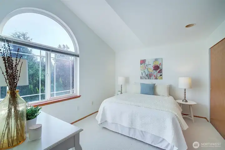 Bedroom #2 features lovely arched window