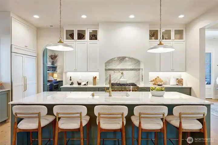 The spacious bar is perfect for hosting, breakfast on the go, or watching the chef at work.