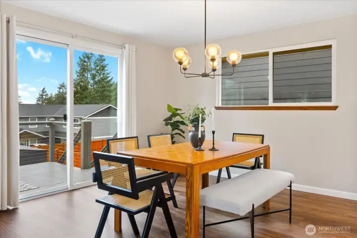 Dining room with slider to the deck with sound views.  Great for entertaining!