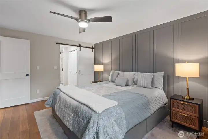 Primary bedroom with accent wall