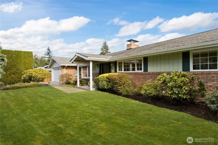Grand two-level home with stunning Lake Sammamish and Cascade views.
