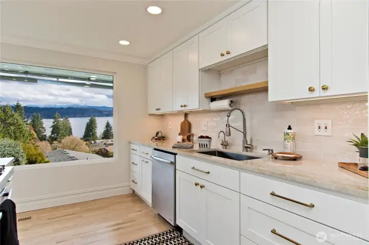 Taj Mahal quartzite countertops and designer backsplash.