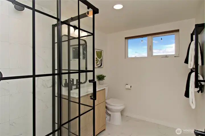Fully remodeled three-quarter bathroom.