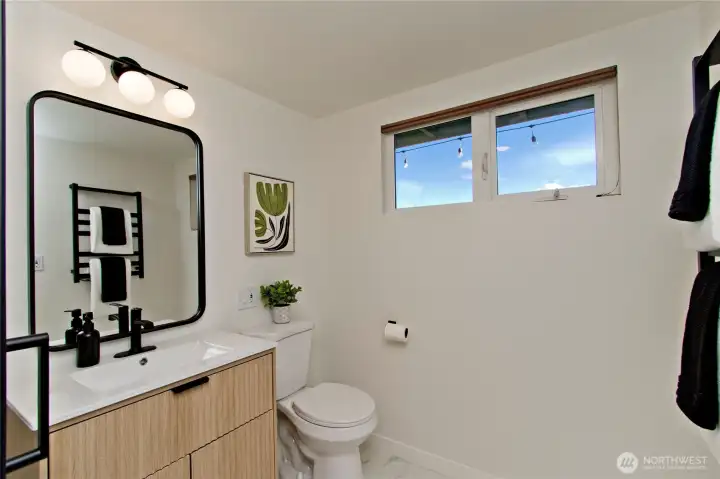 Another view of the remodeled three-quarter bathroom.