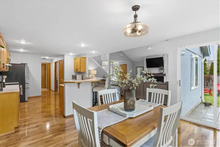 Open concept living on the lower level with laminate floors throughout. Kitchen offers a high bar, stainless appliances  and pantry space.