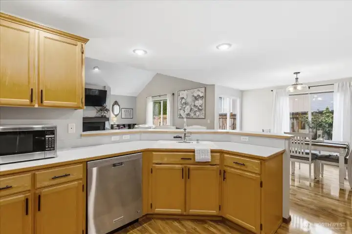 The kitchen offers a high bar with room for 4 chairs, stainless appliances and pantry space.
