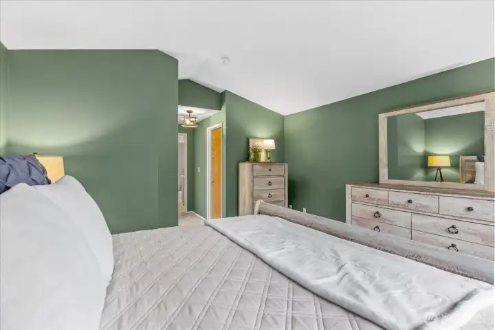 Primary ensuite offers vaulted ceilings, full bath and walk in closet.