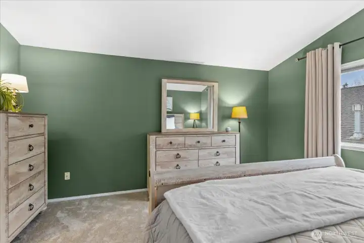 Primary ensuite offers vaulted ceilings, full bath and walk in closet.