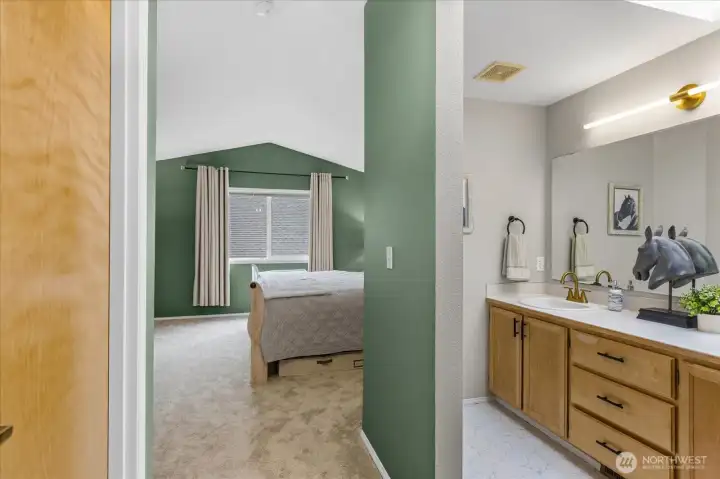 Primary ensuite offers vaulted ceilings, full bath and walk in closet.
