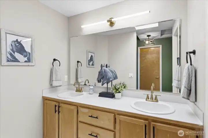 Primary ensuite offers vaulted ceilings, full bath and walk in closet.