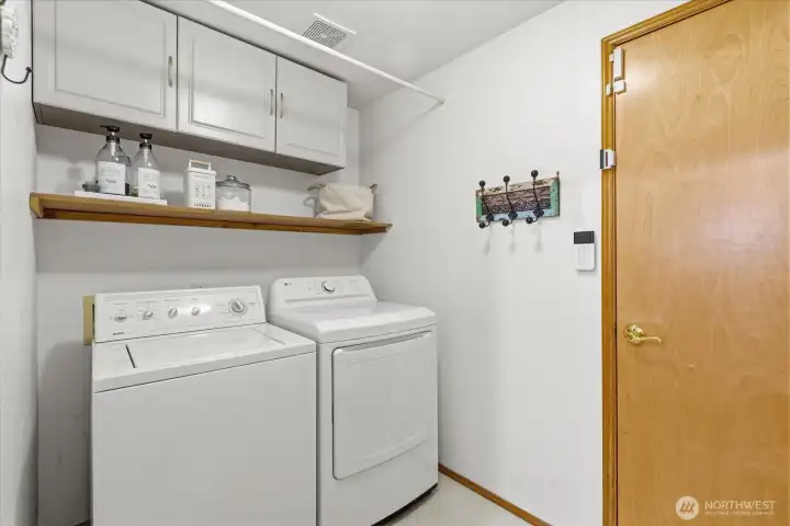 Lower level laundry room, washer & dryer stay.