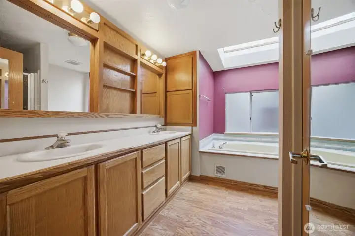 Primary en suite with soaker tub, shower and dual sinks