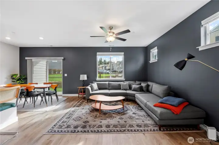 Open-concept living space with 9’ ceilings, luxury plank flooring, and abundant natural light.