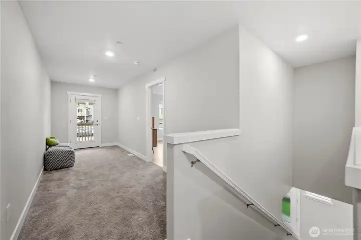 Versatile loft space ideal for a home office, media room, or cozy reading retreat.