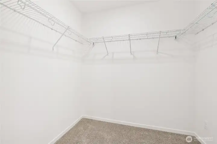Primary walk in closet - Photos are for representational purposes only, colors, elevation and features may vary.