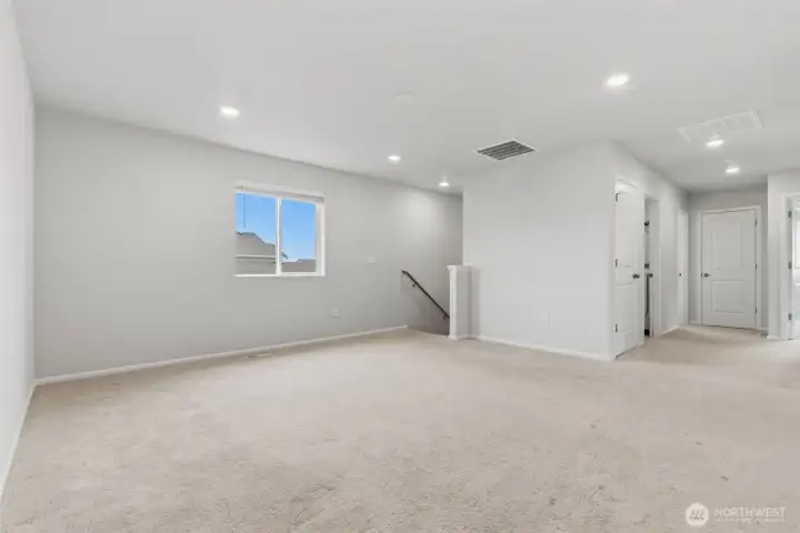Family/sitting room looking towards stairs to the left and hallway to bedrooms