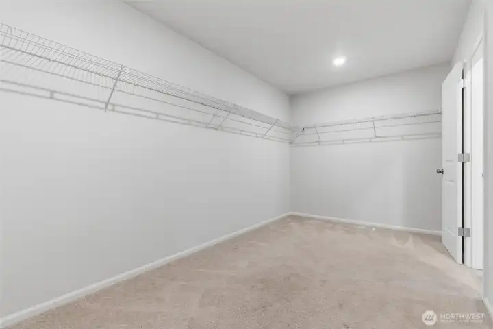 Huge walk-in closet in primary bedroom