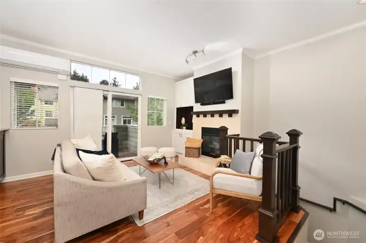 Lots of light, fireplace, extra storage cabinet. TV conveys.