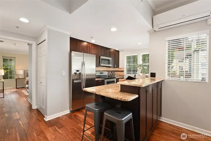 Another view of the kitchen. Notice pantry closet for added storage.
