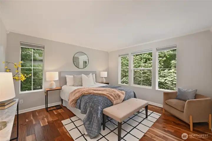 Quite large bedroom with walk-in closet with built-in closet system and natural light from two sides.