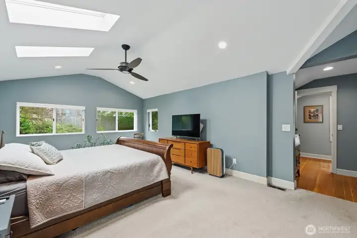 Primary bedroom suite with skylights is on the second floor.