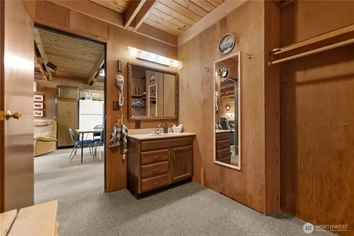 Flexible bonus room offering a cozy sleeping nook, changing area, or additional storage space with rustic cabin charm throughout.