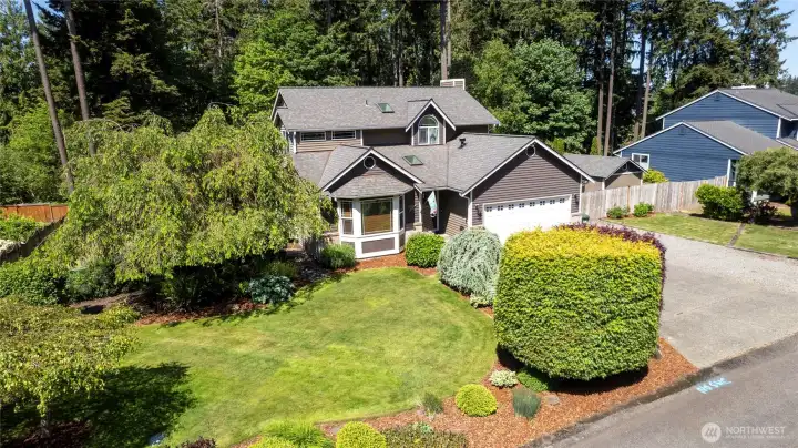 Another angle of this truly amazing property showing fully landscaped front yard.
