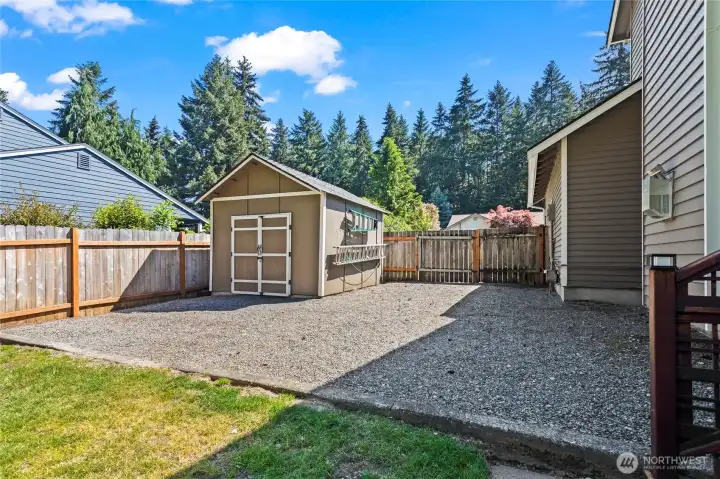 Large shed with power and lighting.Gate swings open for RV Parking