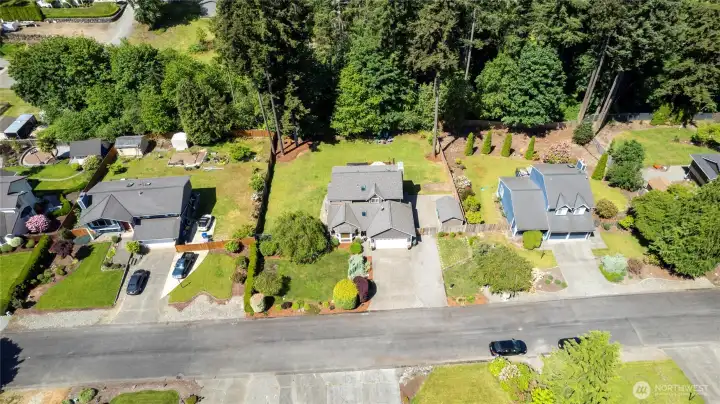 Aerial shot of the home in the middle of the frame.