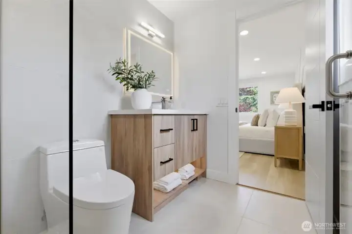 look at the primary bedroom from the primary bathroom look at the primary bedroom from the primary bathroom