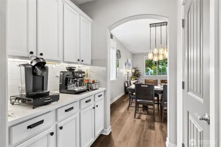 Butler's pantry connects kitchen and dining area adding to the open flow.