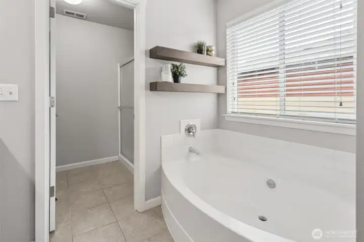 Soak in a large garden tub in the primary suite