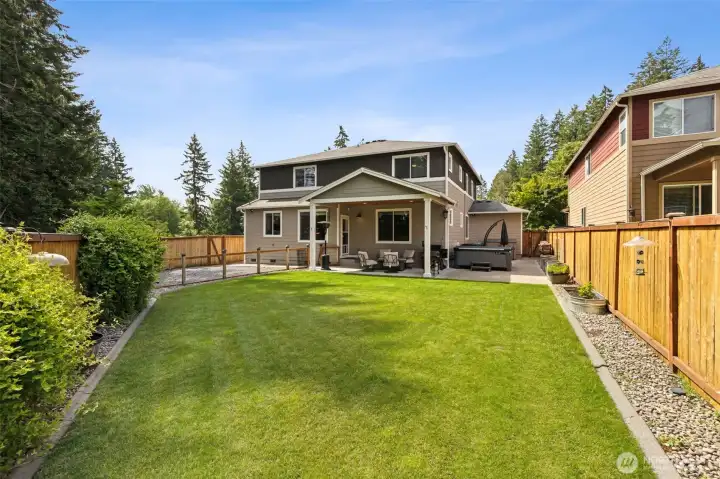 Large lawn with landscape curbing and new fencing!