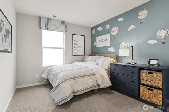 Bedroom 2 offers a cozy sleep space with room for a queen size mattress and more. Actual home is under construction. Colors, materials, and features may vary. See site agent for details. Bedroom 2 offers a cozy sleep space with room for a queen size mattress and more. Actual home is under construction. Colors, materials, and features may vary. See site agent for details.