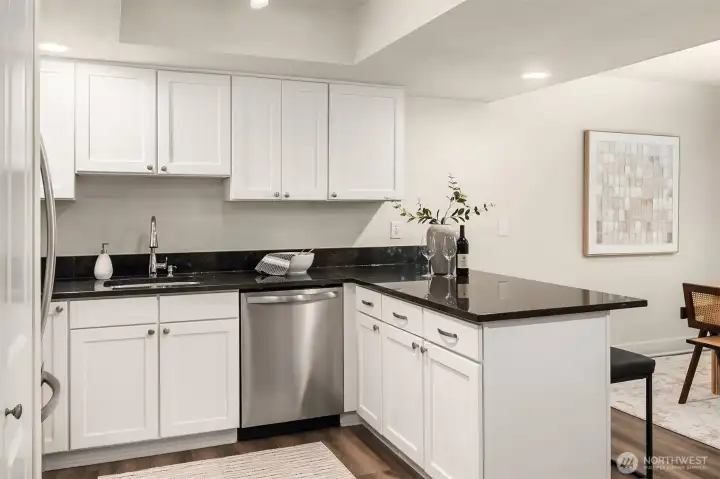 Bright kitchen w/ granite counters.