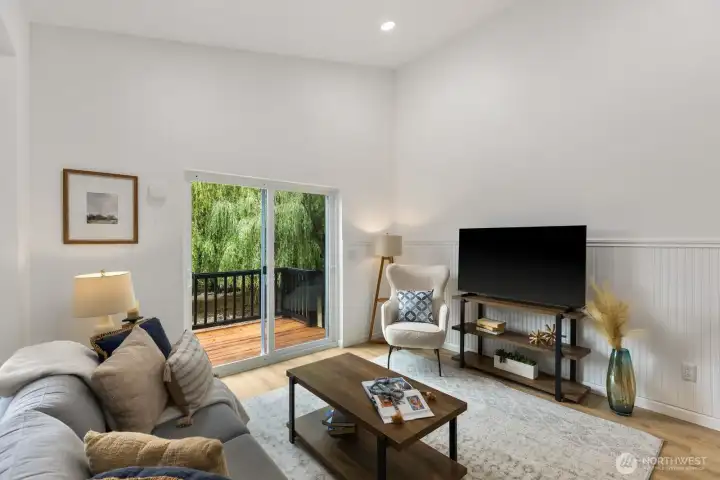 A comfortable, light-filled space with picture windows overlooking mature trees. A comfortable, light-filled space with picture windows overlooking mature trees.