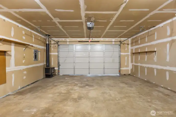 A finished, oversized garage offers versatile potential for a workshop, storage, or hobby space. A finished, oversized garage offers versatile potential for a workshop, storage, or hobby space.