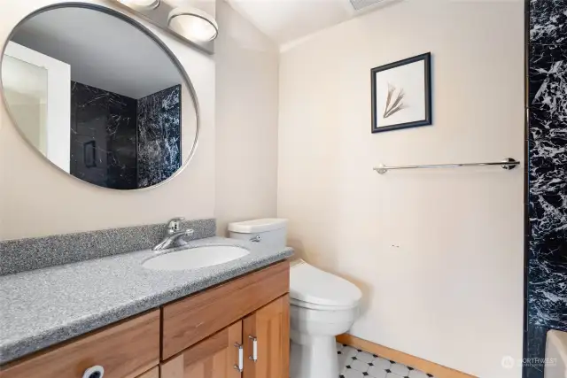 Primary Bathroom - Full size bathroom with shower and tub combo