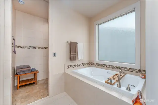 Luxurious Ensuite Bathroom with a Soaking tub and large tiled shower.