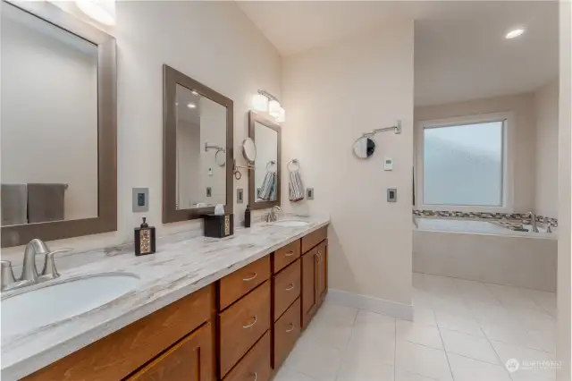 Double vanity, radiant heated floors in primary bathroom