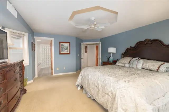 Primary bedroom suite with French doors looking toward bath