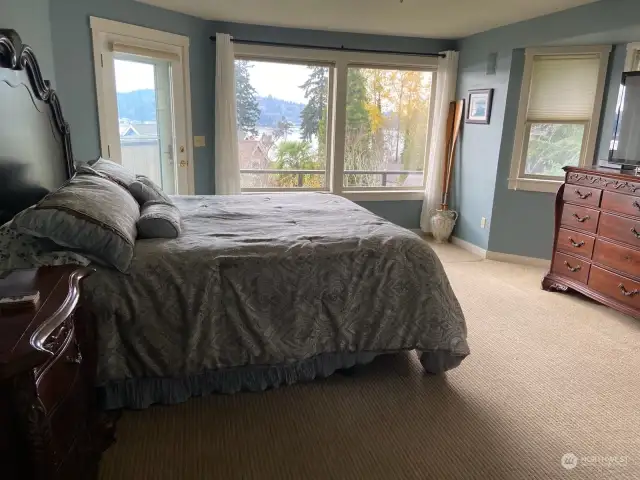 Primary bedroom with view and deck access