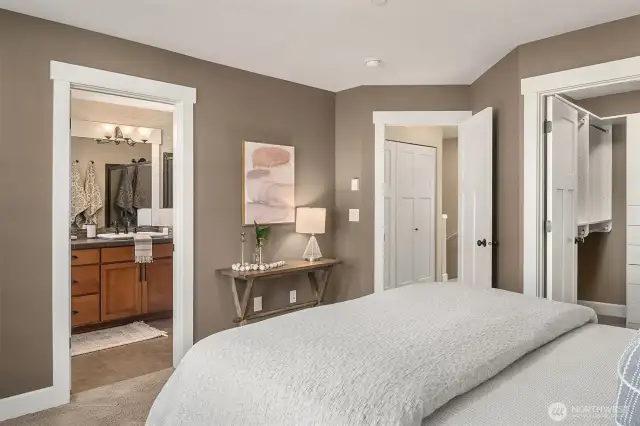 Looking towards the ensuite, walk-in closet and bedroom doorways from the opposite picture window wall.