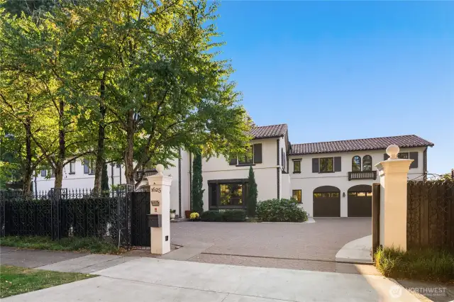 This home is completely gated & secure with two auto gates and an auto court that can house up to 10 cars. The three garage doors house a beautiful heated garage with high ceilings, parking for 4 cars (one tandem spot), and plenty of storage room for all your toys! Over the garage, but not pictured in this photo gallery is a state of the art GYM!