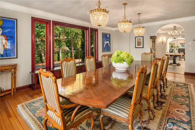 The scale of this formal dining room is incredible. Notice the 3 chandelier's over the table-these are from the Plaza hotel in New York!