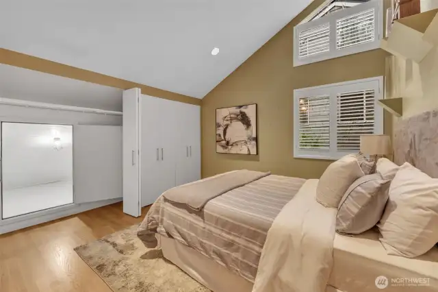 A second ensuite bedroom fills out the upstairs, with vaulted ceiling and wall to wall closet, with additional finished storage space accessible thru the back of the closet.