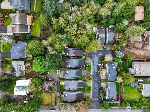 Overhead, you can see the rare setting the home offers with lush surroundings, yet minutes to everything you need