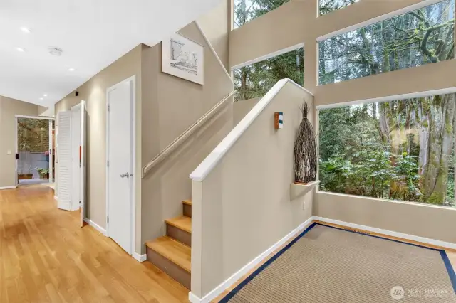 Entering the home, one is stuck by the two-story, sunny entrance. Hardwood floors flow thru out the home